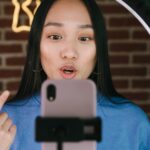 a woman recording herself with a smartphone