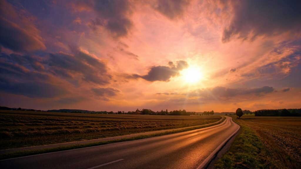 asphalt road during sunset