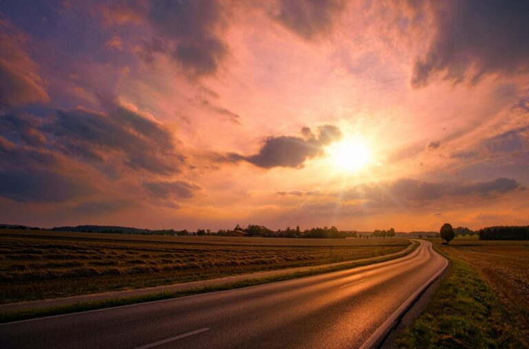 asphalt road during sunset